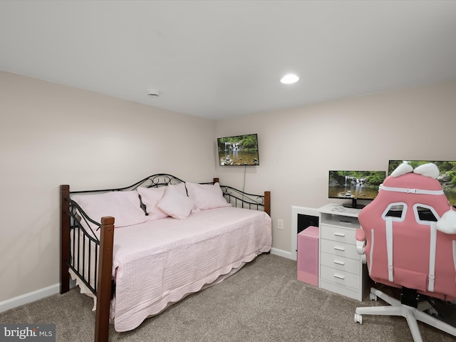 carpeted bedroom featuring baseboards