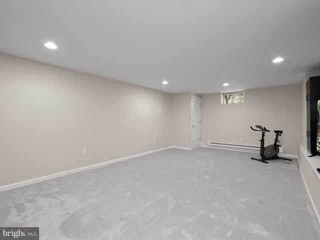 exercise room with recessed lighting and light carpet