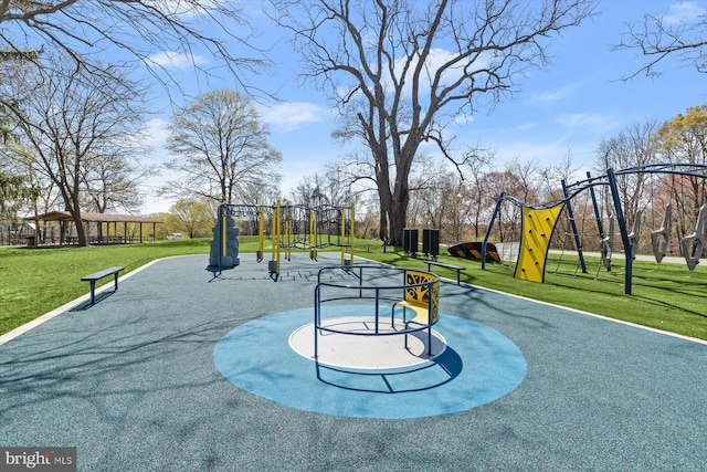 view of home's community with a lawn and playground community
