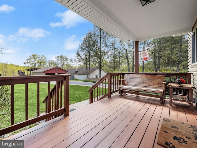 deck featuring a yard
