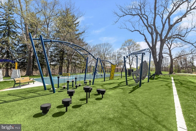view of community with playground community and a yard