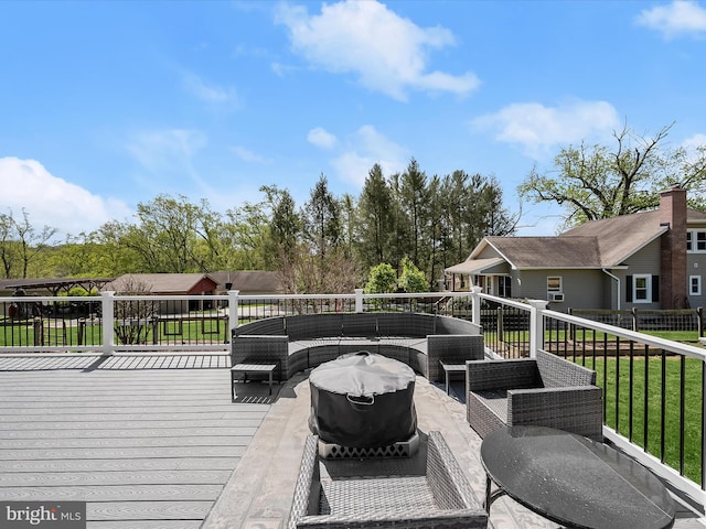 wooden terrace featuring outdoor lounge area