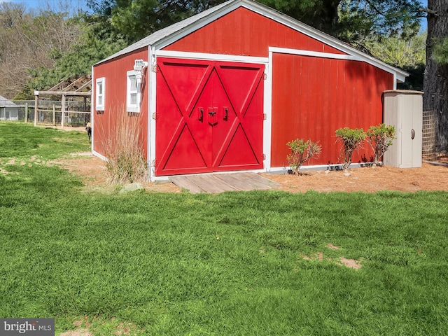 view of shed with fence