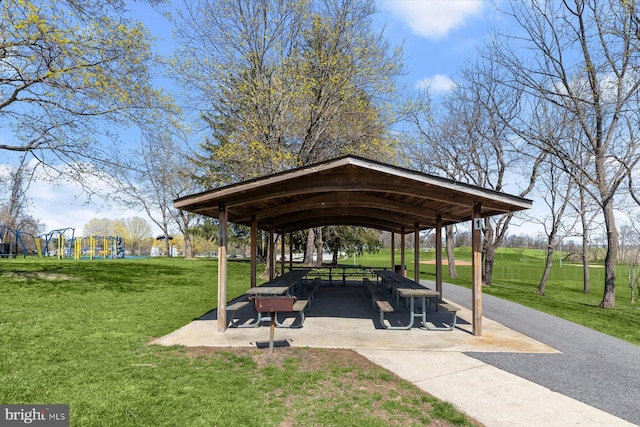 view of property's community featuring a lawn, a gazebo, and a playground