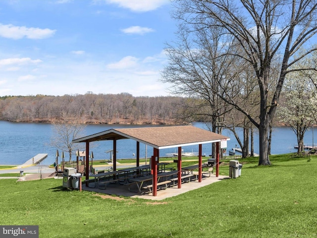 view of dock featuring a lawn, a gazebo, and a water view