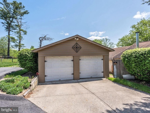detached garage with fence