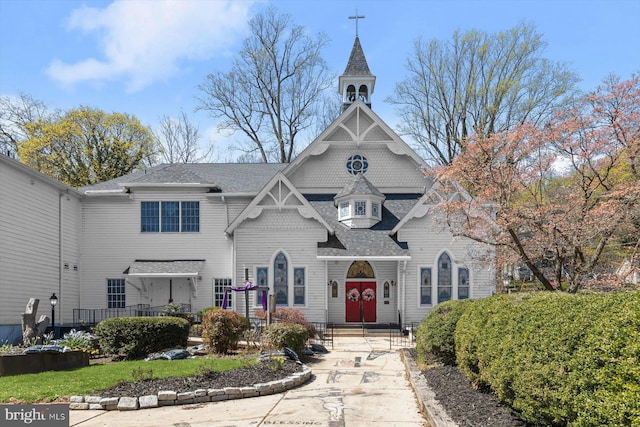 view of front of house featuring roof with shingles