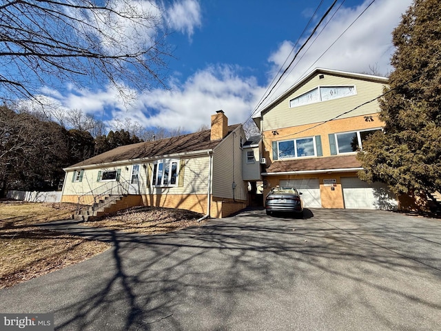 view of front of house featuring a garage and driveway