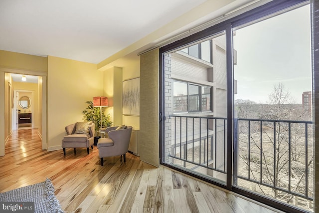 living area featuring wood finished floors and baseboards