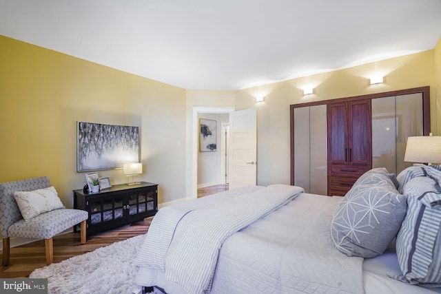 bedroom featuring a closet and wood finished floors