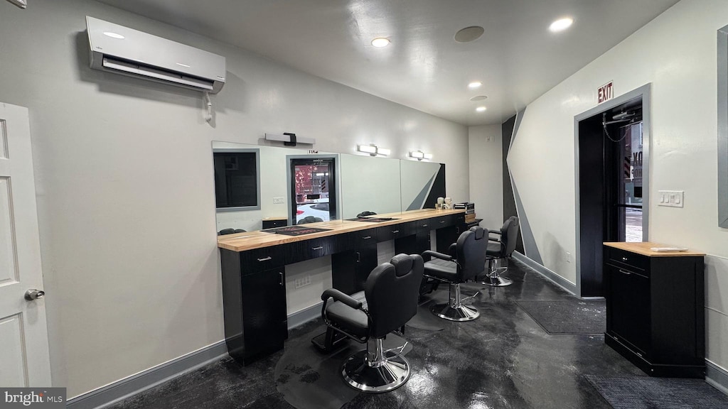 home office with concrete flooring, recessed lighting, baseboards, and a wall mounted AC