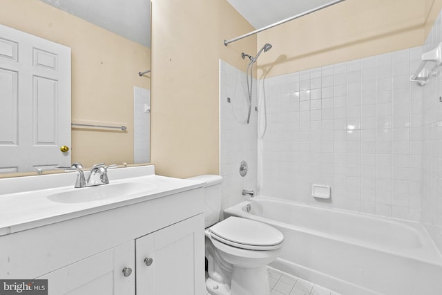 bathroom with vanity, tile patterned flooring, toilet, and shower / washtub combination