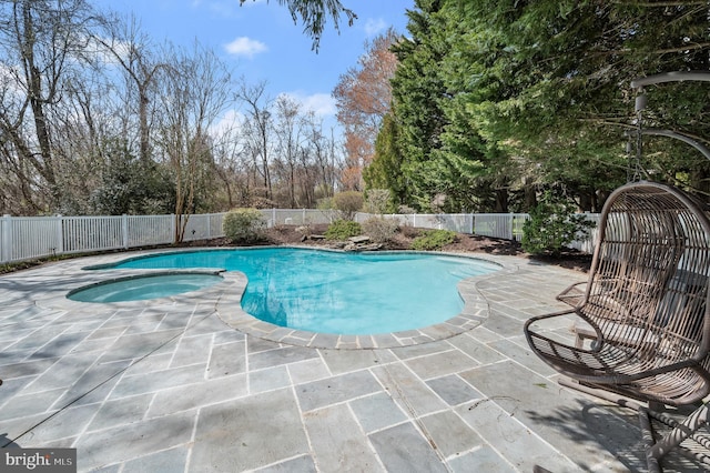 view of swimming pool with a fenced in pool, a fenced backyard, an in ground hot tub, and a patio
