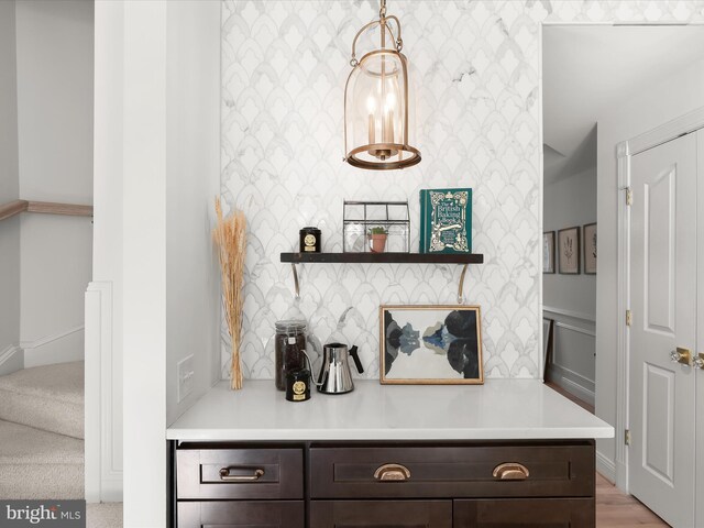 interior details featuring wallpapered walls