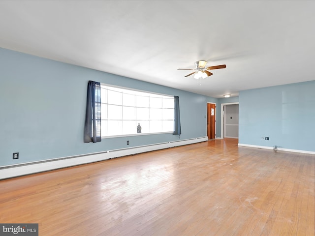 unfurnished living room featuring ceiling fan, a baseboard radiator, wood finished floors, and baseboards