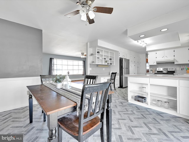 dining space featuring a ceiling fan