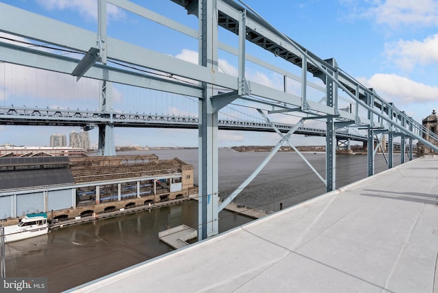 dock area with a water view and a city view