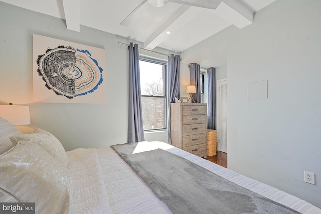 bedroom featuring beamed ceiling