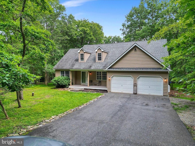 cape cod house with driveway, a front lawn, covered porch, an attached garage, and a shingled roof