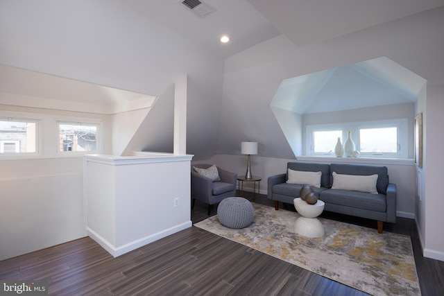 living room featuring recessed lighting, dark wood-type flooring, visible vents, baseboards, and vaulted ceiling