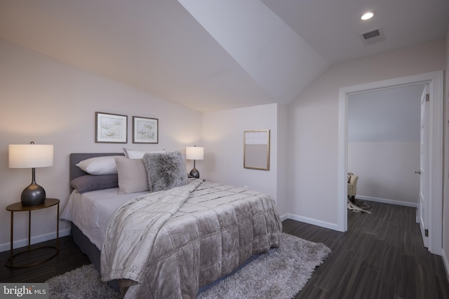 bedroom featuring recessed lighting, visible vents, baseboards, vaulted ceiling, and dark wood finished floors