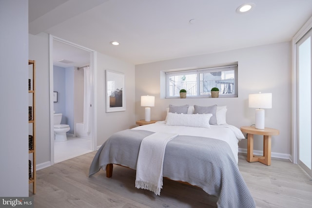 bedroom with light wood-style floors, baseboards, and recessed lighting