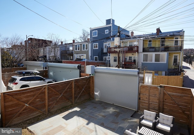 view of patio / terrace featuring a gate and fence