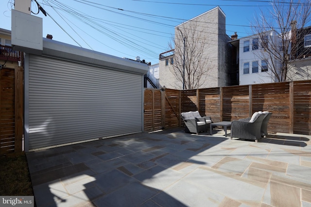 view of patio / terrace with a gate and fence