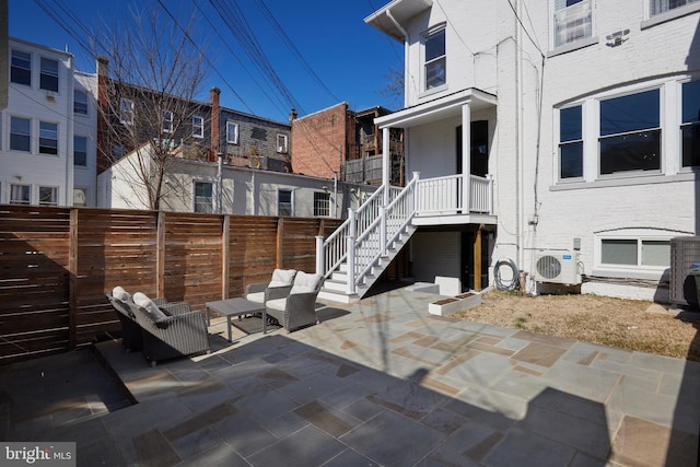 view of patio / terrace with ac unit and fence