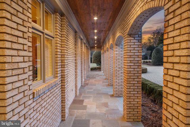 view of patio terrace at dusk