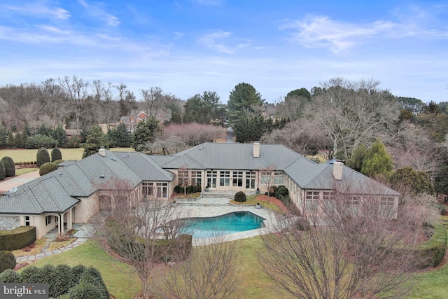 outdoor pool with a lawn