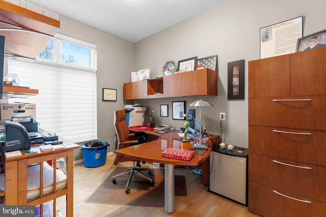 home office featuring light wood-style flooring