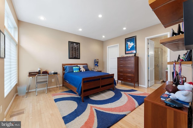 bedroom with baseboards, light wood-style flooring, and recessed lighting