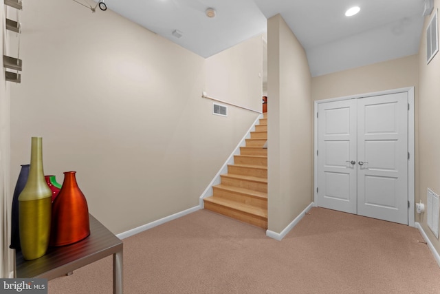 interior space with recessed lighting, carpet, visible vents, and baseboards