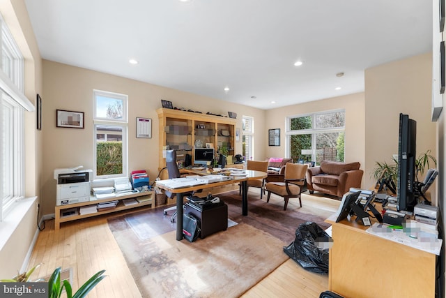 office area featuring recessed lighting, a wealth of natural light, and wood finished floors