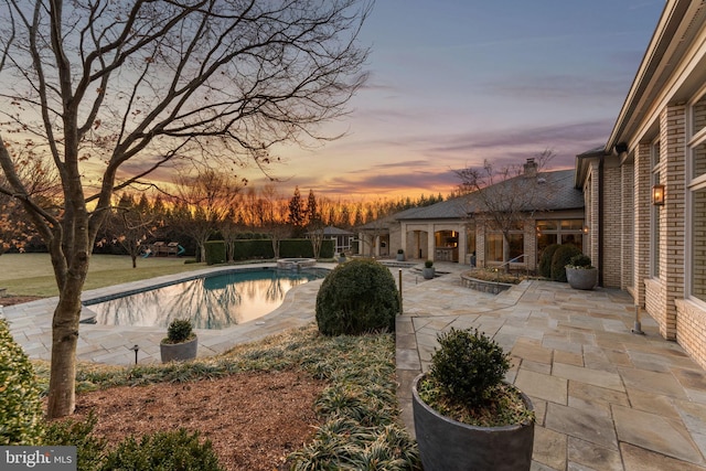 pool with a patio