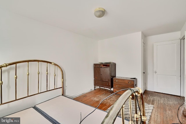 bedroom featuring dark wood-style floors