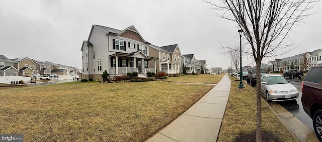 view of road with sidewalks, a residential view, and street lighting