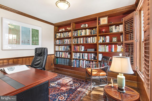 office area with wood finished floors and a wainscoted wall