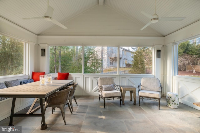 sunroom featuring lofted ceiling and ceiling fan