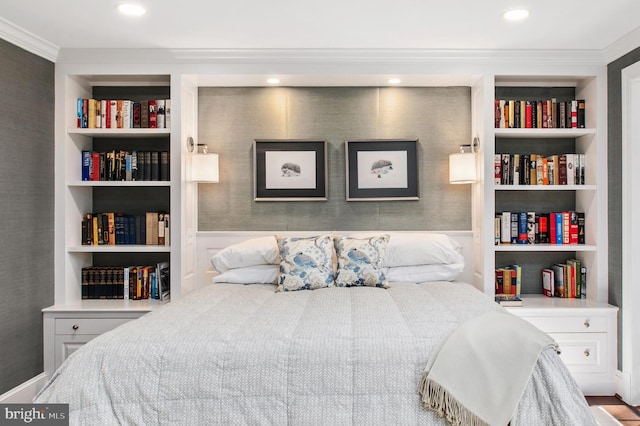 bedroom with crown molding and recessed lighting