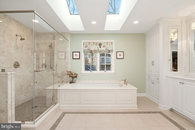 bathroom with a bath, recessed lighting, a stall shower, and baseboards