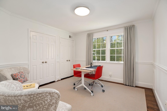 office with visible vents, baseboards, wood finished floors, and crown molding