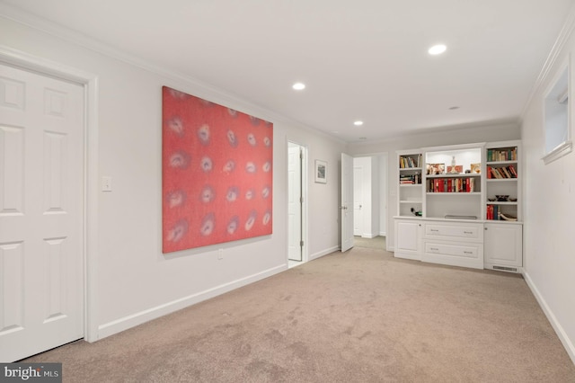 interior space with recessed lighting, light colored carpet, baseboards, and ornamental molding