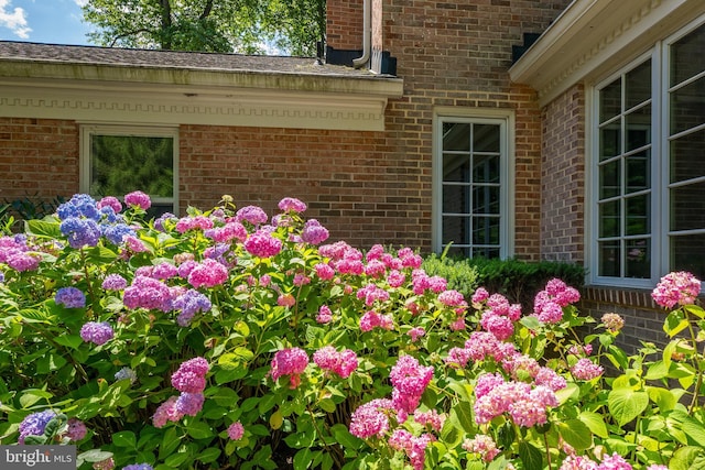 exterior details featuring brick siding