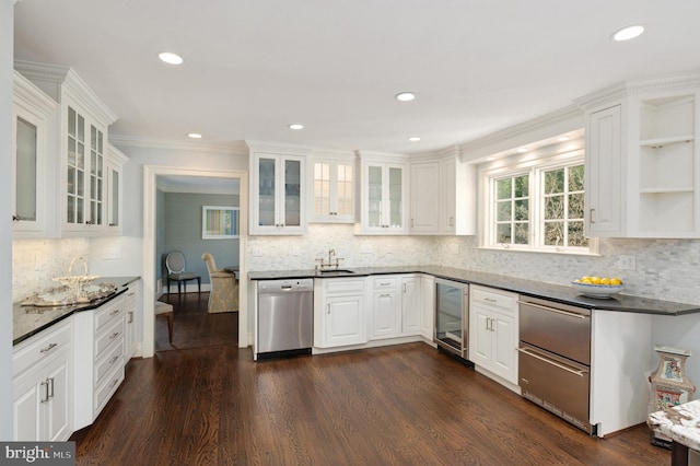 kitchen with dishwasher, wine cooler, white cabinets, and a sink