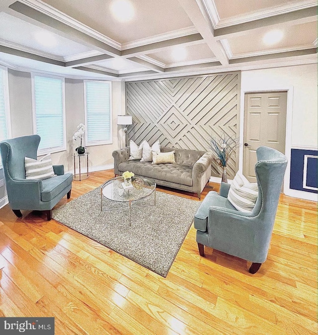 living area with beamed ceiling, coffered ceiling, wood finished floors, and crown molding