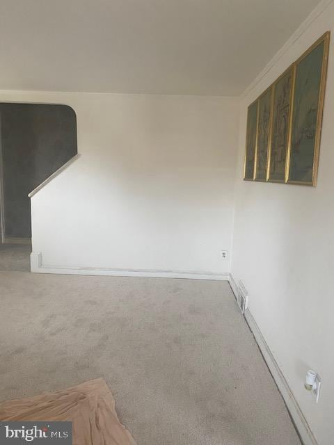 carpeted spare room with visible vents