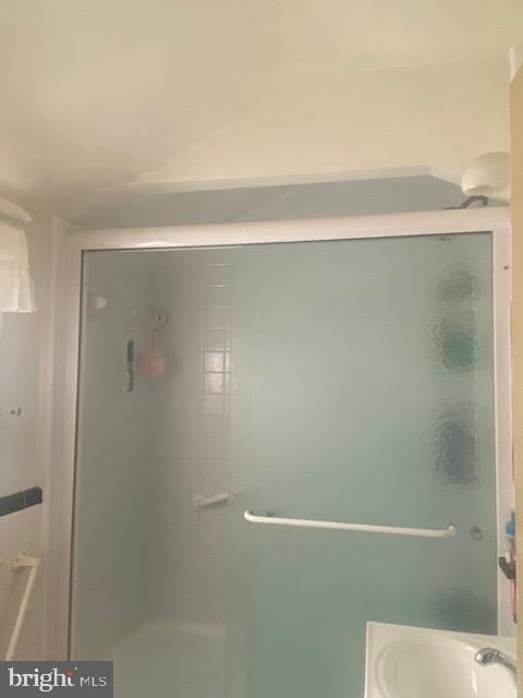 full bath featuring a shower stall