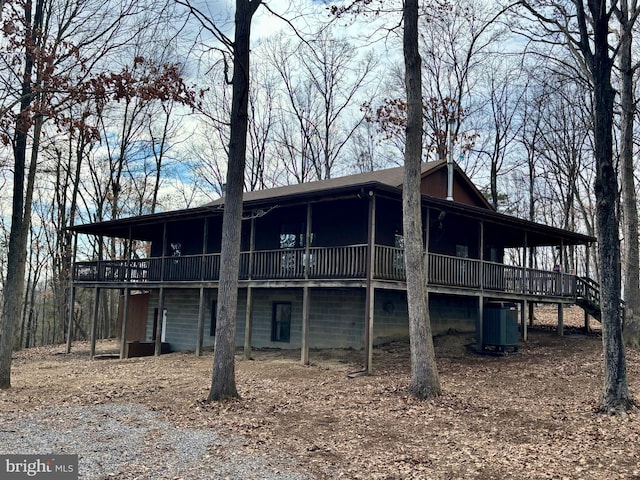 back of property featuring a deck and central AC unit